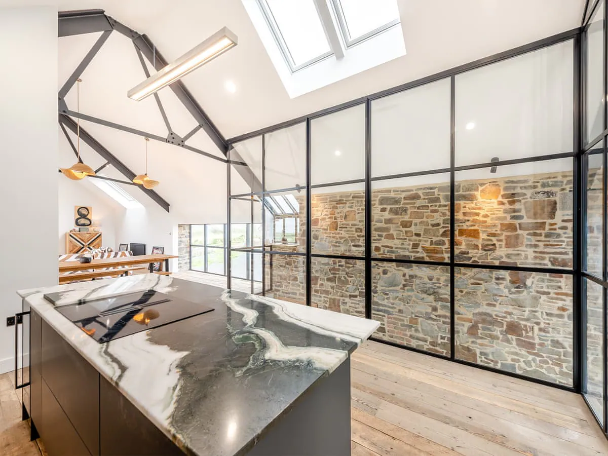 Barn kitchen with marble island and exposed beams