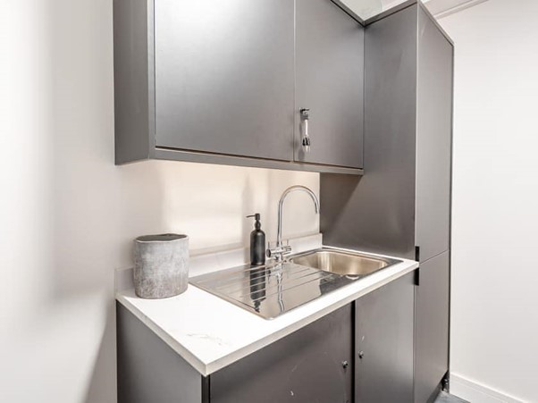 Utility and boot room with sink