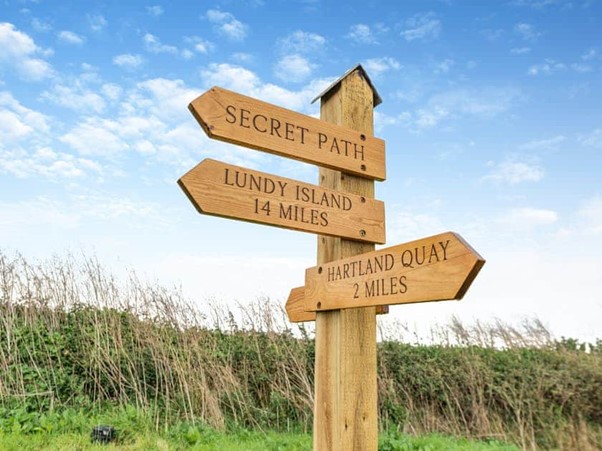Wooden signpost: Secret Path, Lundy Island, Hartland Quay
